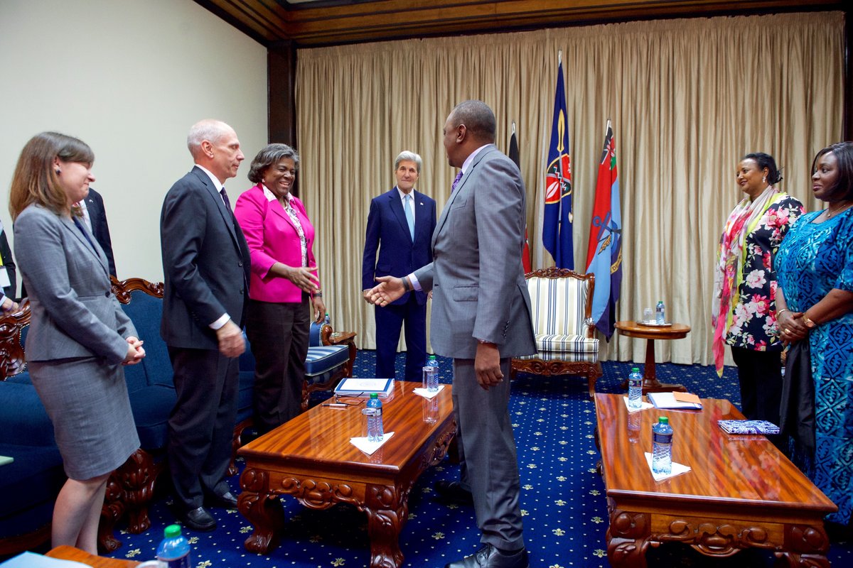 Kenyan President Uhuru Kenyatta shakes hands with Assistant Secretary of State Linda Thomas Greenfield at State House Nairobi