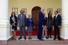 U.S. Secretary of State John Kerry speaking with son of Kenyan President Uhuru Kenyatta at State House Nairobi