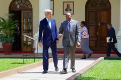 U.S. Secretary of State John Kerry and Kenyan President Uhuru Kenyatta walking across courtyard at State House Nairobi