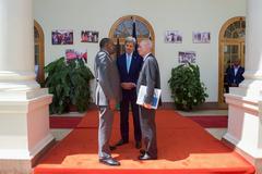 Kenyan President Uhuru Kenyatta talks with U.S. Secretary of State John Kerry and U.S. Ambassador Robert Godec at State House Nairobi