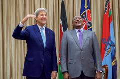 US Secretary of State John Kerry jokes about his height standing with Kenyan President Uhuru Kenyatta at State House Nairobi on August 22, 2016