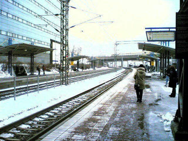 Käpylä railway station in Helsinki with red wooden buildings and railway tracks