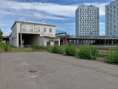 Exterior view of Malmi Railway Station with modern architecture and clear sky