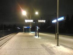 Pukinmäki railway station platform with tracks in Helsinki, Finland