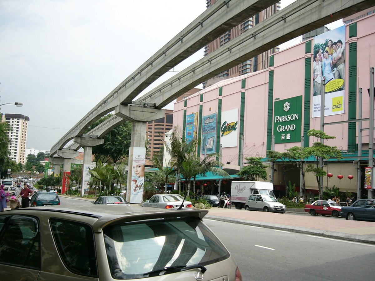 Night view of Bukit Bintang district in Kuala Lumpur with illuminated buildings and streets