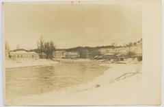 Historic black and white photograph of Vilnius cityscape featuring the Vialla river and Antokal district with Słuszko Palace in the background from 1925