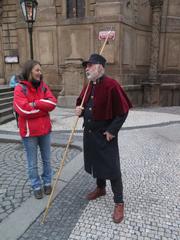 The lamplighter on Křižovnické Naměstí in Prague during autumn 2023