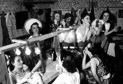 Women chorus performers at Teatro Maipo applying makeup before going on stage in Buenos Aires, 1939