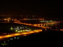 Night view of Indian Institute of Technology Guwahati campus with illuminated buildings and greenery