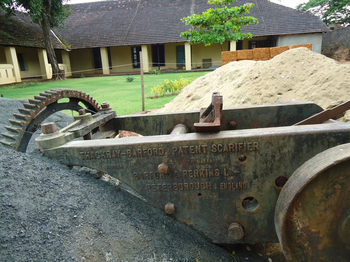 Close-up view of a Patent Scarifier agricultural tool with metal spikes