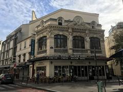 Street view of Rue de la Gaîté in Paris with Théâtre Montparnasse building