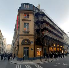 Paris Théâtre du Palais-Royal exterior with classical architecture and people walking