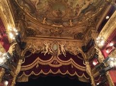 Interior view of the Théâtre du Palais-Royal in Paris with ornate balconies and chandeliers