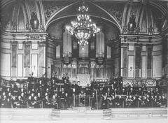 Tonhalle Zürich concert hall with orchestra and conductor Friedrich Hegar on stage