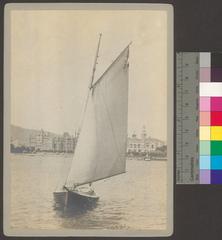 Sailboat sailing in front of a red castle at the Zurich Central Library
