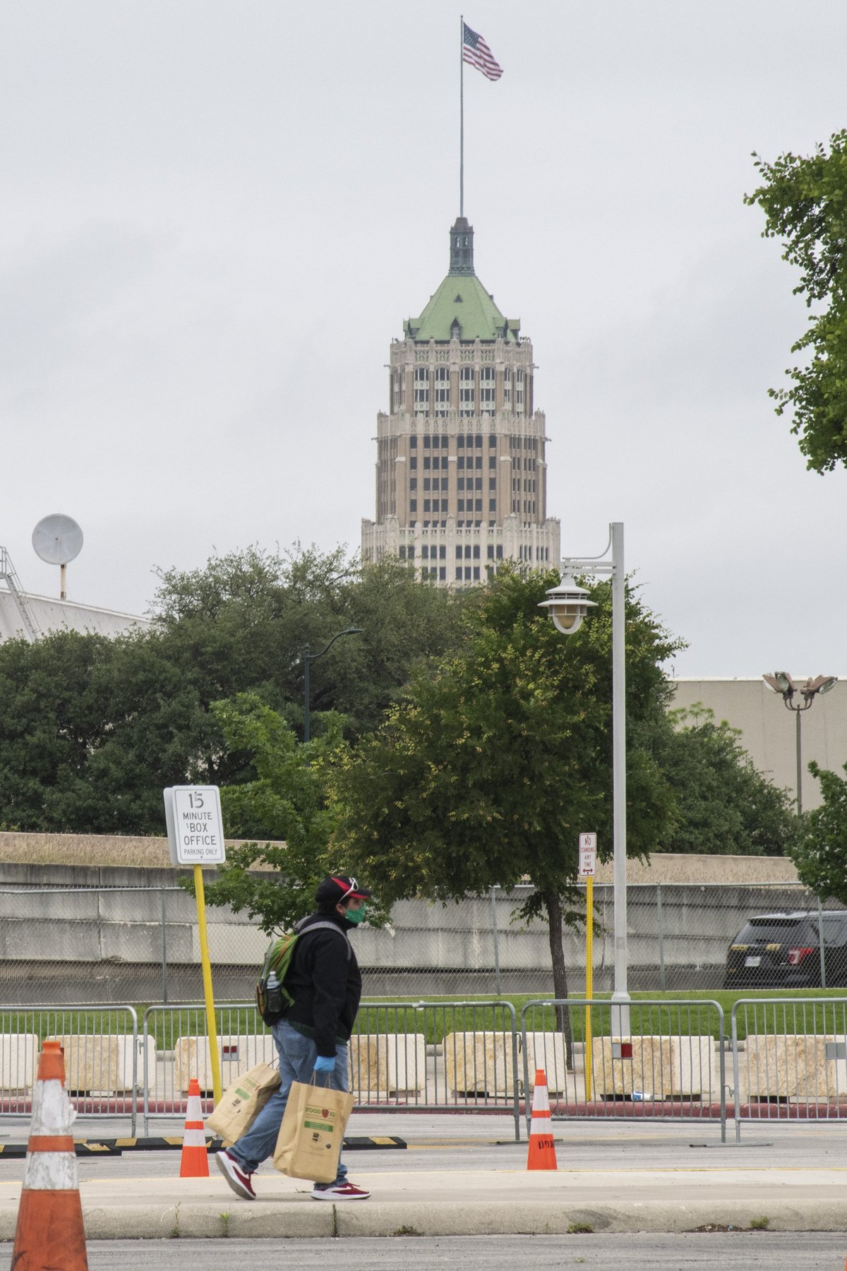 Volunteers distributing food bags at San Antonio Food Bank mass distribution site in Alamodome during USDA Disaster Household Distributions