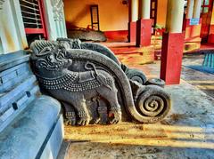 Sree Ananthapadmanabha Swamy temple in Kumbla Kerala inside square water tank with foot bridge and wooden ceiling artwork