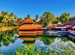 Sree Ananthapadmanabha Swamy temple in Kumbala Kerala surrounded by a square water tank with foot bridge