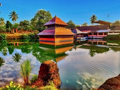 Sree Ananthapadmanabha Swamy temple surrounded by a large square water tank in Kumbla, Kerala
