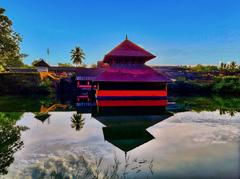Sree Ananthapadmanabha Swamy temple inside a large square water tank in Kumbala, Kerala, a historic 9th or 10th century Hindu Vishnu temple known as the Lake temple of Vishnu