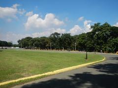 Quezon Memorial Circle at Elliptical Road in Quezon City with tall memorial monument and surrounding greenery