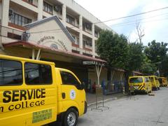 Santo Domingo Avenue intersection with Gregorio Araneta Avenue in Quezon City showing Angelicum College, Santo Domingo Church, and urban street scene