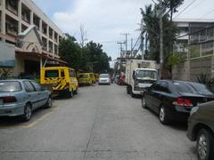 Santo Domingo Avenue view from corner of Gregorio Araneta Avenue featuring Angelicum College and nearby Santo Domingo Church in Quezon City