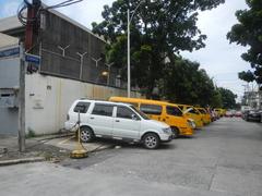 Santo Domingo Avenue at the corner of Gregorio Araneta Avenue in Quezon City with Angelicum College and Santo Domingo Church in the background