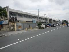 View of Santo Domingo Avenue from Gregorio Araneta Avenue corner in Quezon City Philippines with Angelicum College and Santo Domingo Church