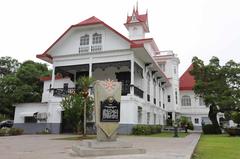 Kawit Philippine Nationhood Trail memorial pedestal and historical marker with Aguinaldo Shrine in background