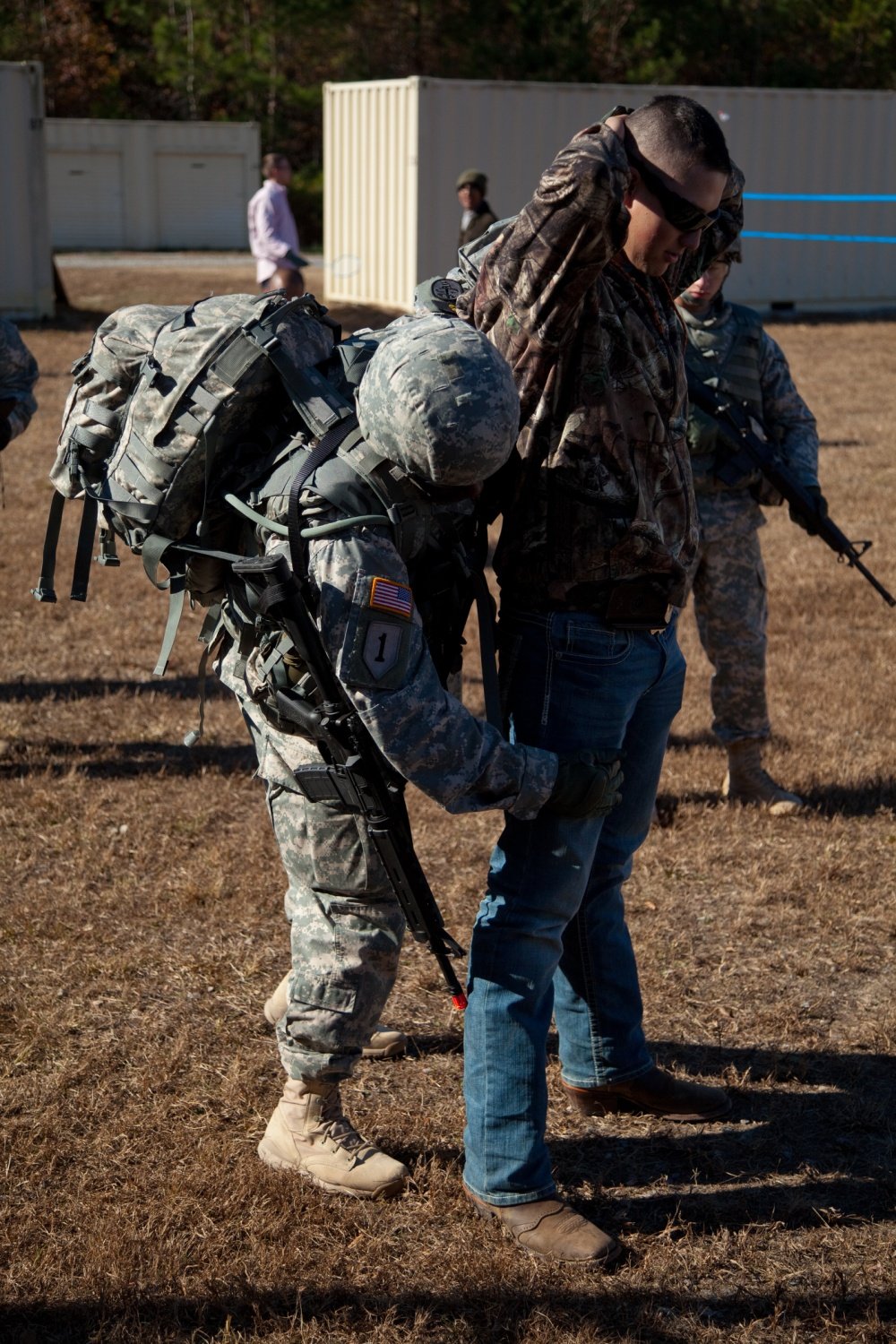 U.S. Army Sgt. 1st Class Ronnie Reynolds searching a simulated civilian during the 2013 Army Best Warrior Competition at Fort Lee