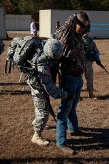 U.S. Army Sgt. 1st Class Ronnie Reynolds searching a simulated civilian during the 2013 Army Best Warrior Competition at Fort Lee