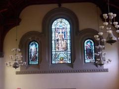Gothic stained glass window inside University College eastern wing