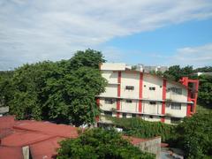San Beda College building viewed from the pedestrian footbridge connecting Doroteo Jose LRT Station and Recto LRT Station in Manila
