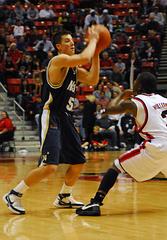 US Navy Midshipman Chris Harris passing basketball during game against San Diego State University Aztecs