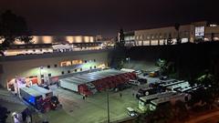 Old bleachers of the Aztec Bowl surrounding a loading area with Nicki Minaj tour trucks and buses on December 15, 2023