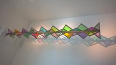 Plato's Disco concept art with abstract geometric shapes and vibrant colors