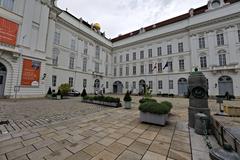 Josefsplatz square with historic buildings in Vienna under clear sky
