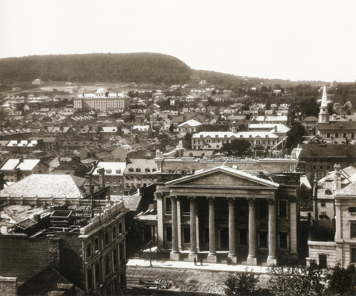 Bank of Montreal under construction at Place d'Armes seen from Notre Dame Basilica in Montreal