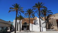 Es Baluard Museum courtyard in Palma de Mallorca with historical walls and palm trees