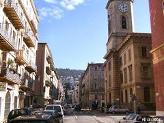 Street view of Rue Fodere with buildings and shops in daytime
