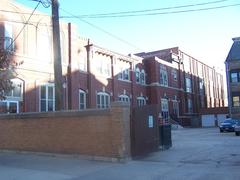 Parish hall and school building seen from the schoolyard on a sunny day