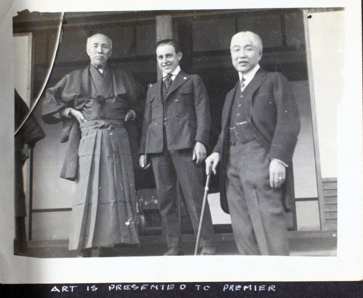 Albert Menasco in his aircraft during aviation exhibition trip to Asia with Art Smith