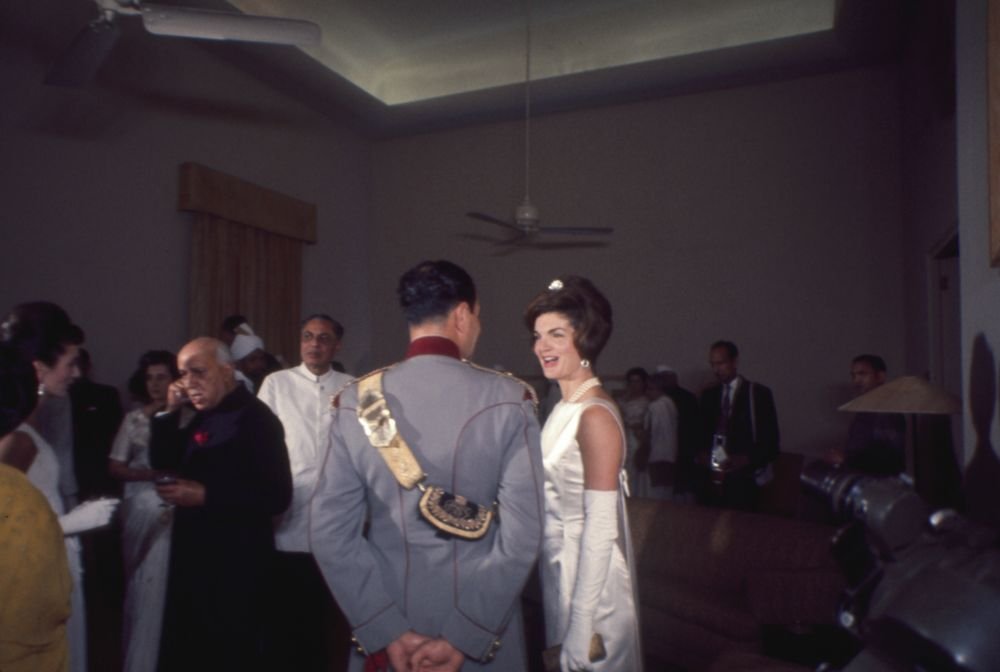 First Lady Jacqueline Kennedy attending a dinner at Teen Murti Bhavan with Prime Minister Jawaharlal Nehru and guests in New Delhi, India