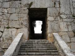 Ancient Porta Maggiore gate in Alatri, Italy, under blue sky