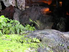 August 2003 cave entrance in Ha Long Bay with rocky cliffs and turquoise water
