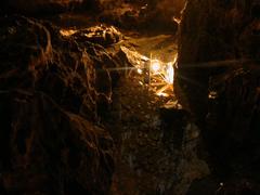 Cave interior in Ha Long Bay with rocky formations and reflective water