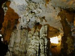 Cave entrance in Ha Long Bay with sunlight illuminating the rocky interior in August 2003
