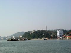 Ferry boat Bãi Cháy with scenic water and city skyline background