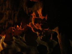 Scenic cave in Ha Long Bay during August 2003 with beautiful natural rock formations and blue water